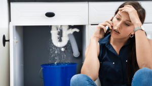 Woman calling about leaking kitchen sink